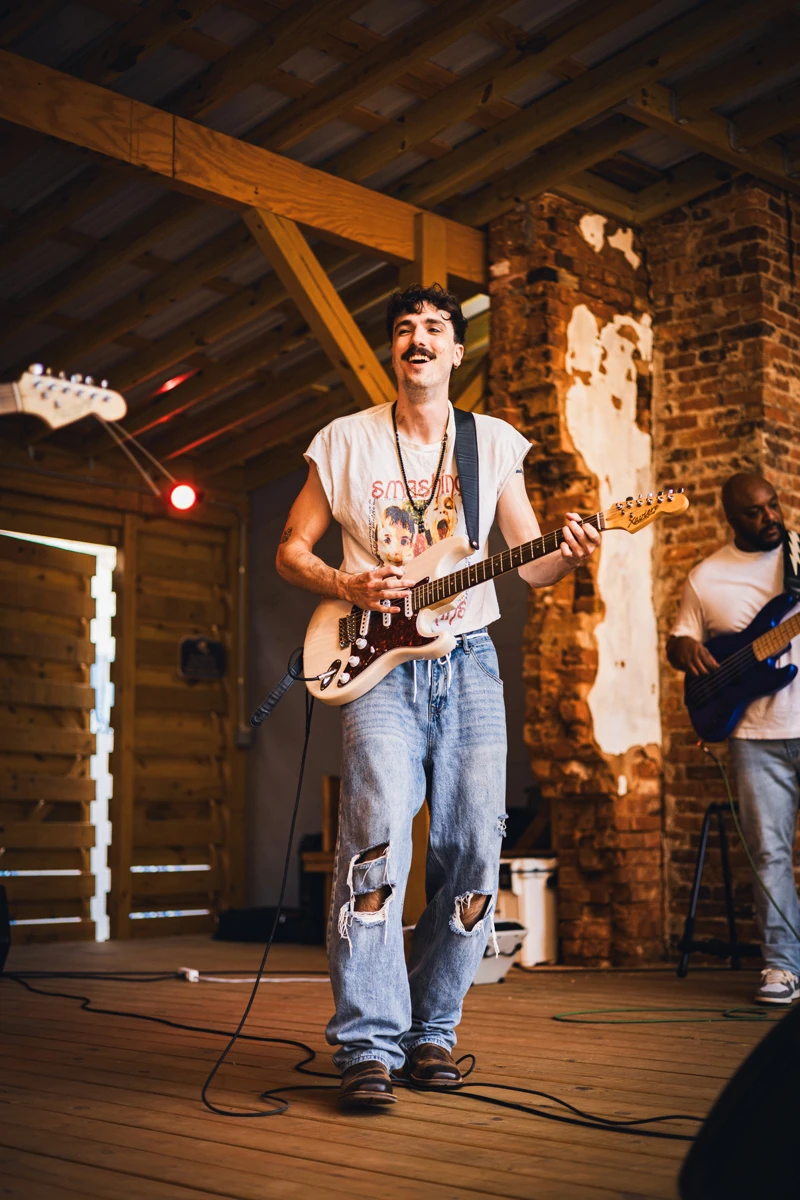 Peyton Kyle performing on guitar
